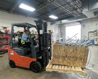 Ruth Lopez driving her fork lift at GRIC CO 