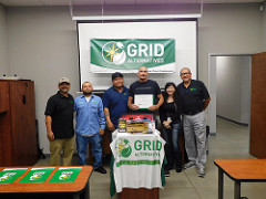 Graduates of GRID Central Valley's training program pose proudly