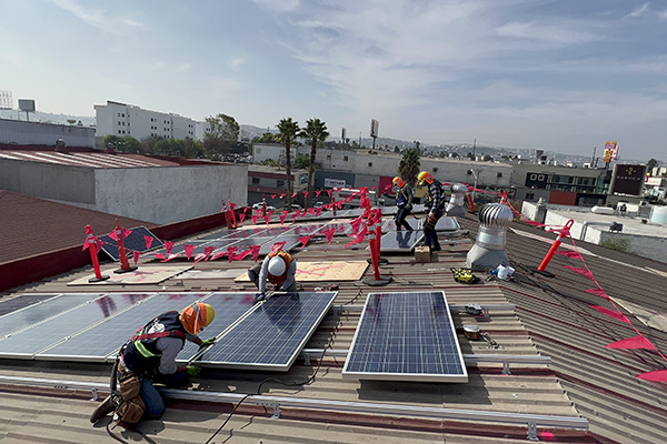 Crew on the roof of the Ciudad orphanage