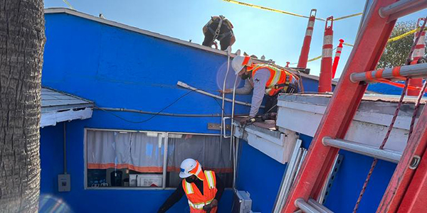 GRID crew work on the YMCA building