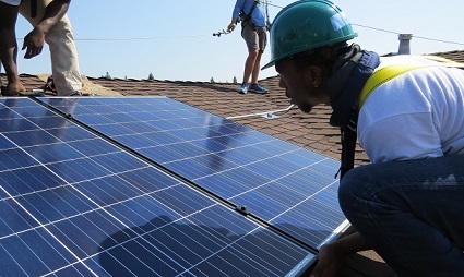 Installers laying a module