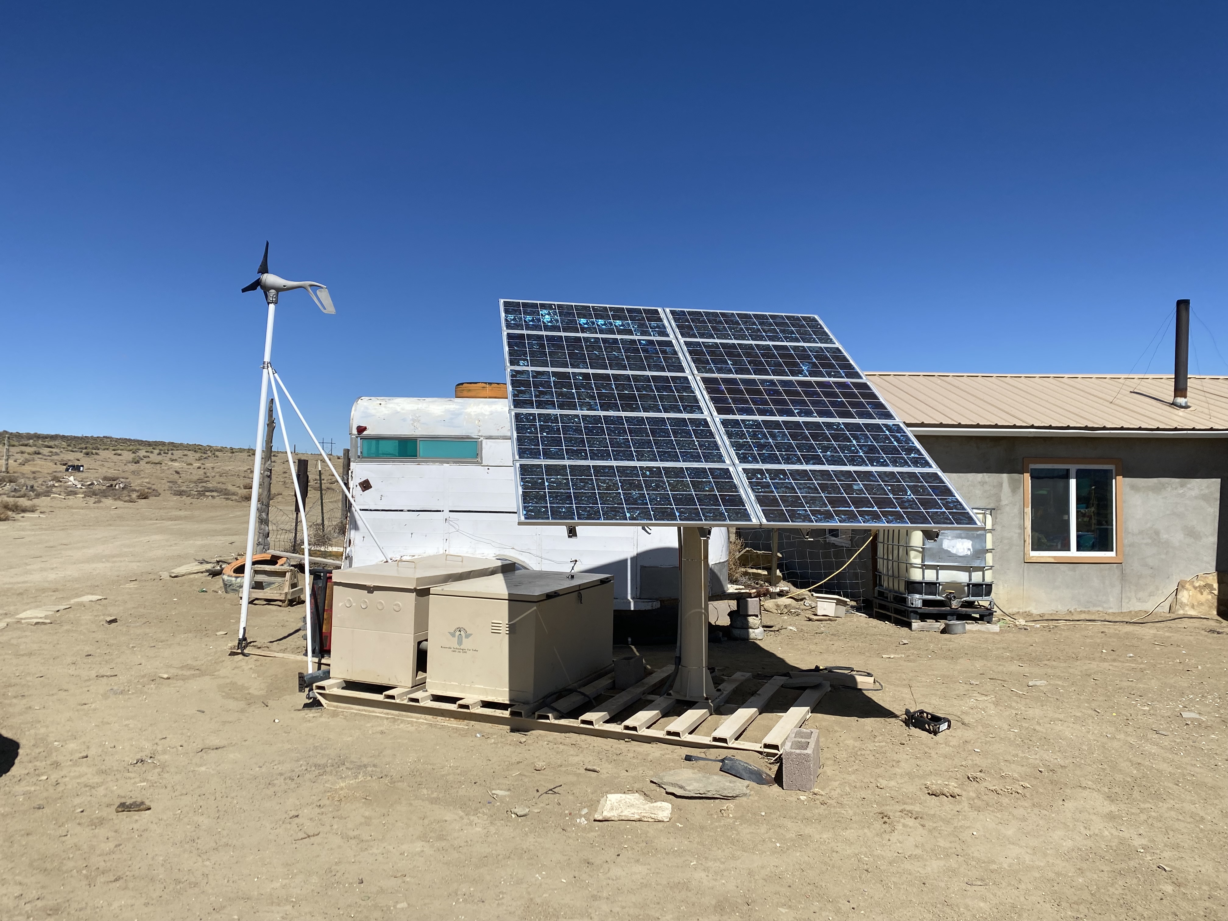 Off-grid PV system in front of a modest home