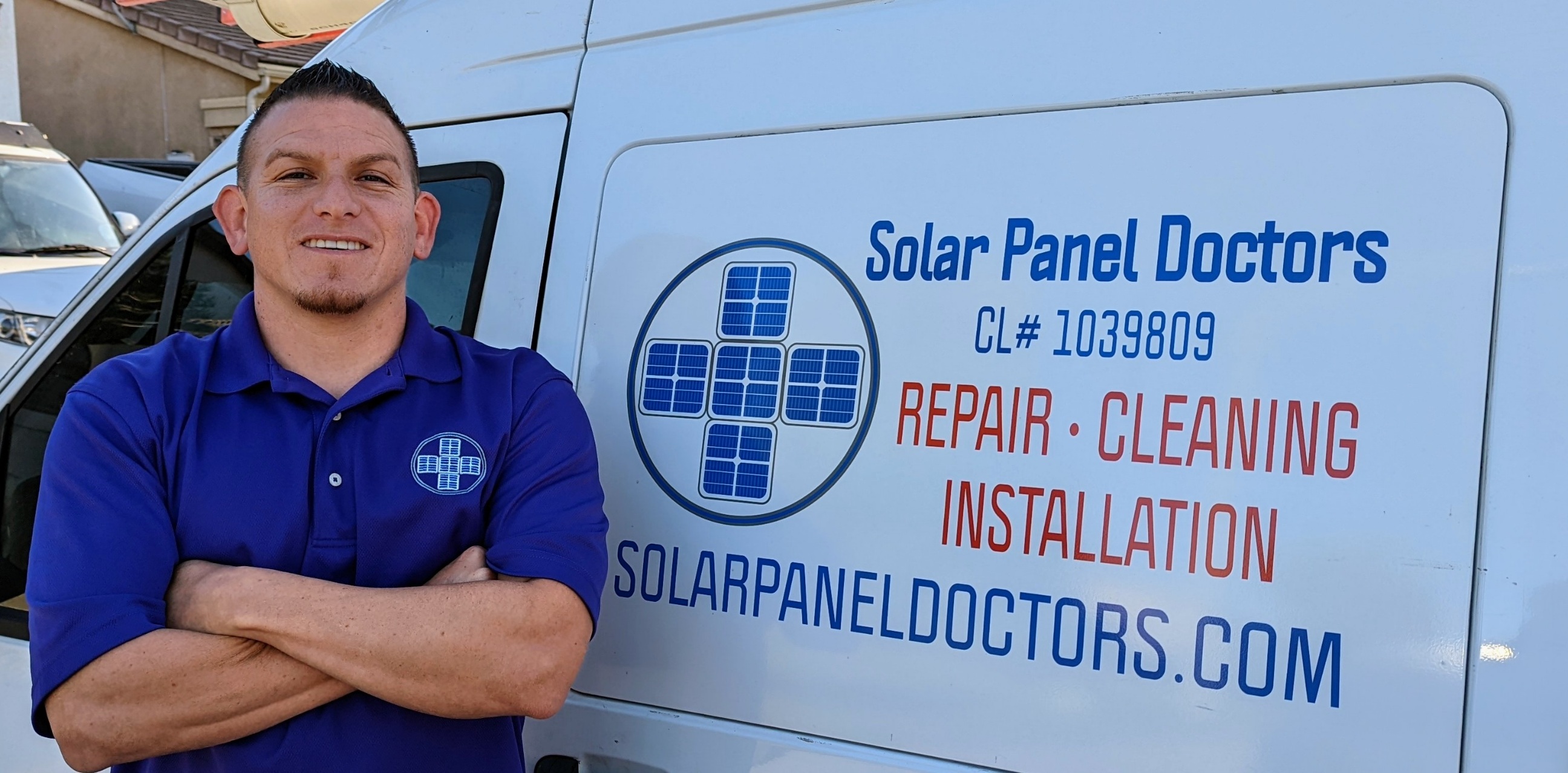 Nicholas Anderson of Solar Panel Doctors by his van
