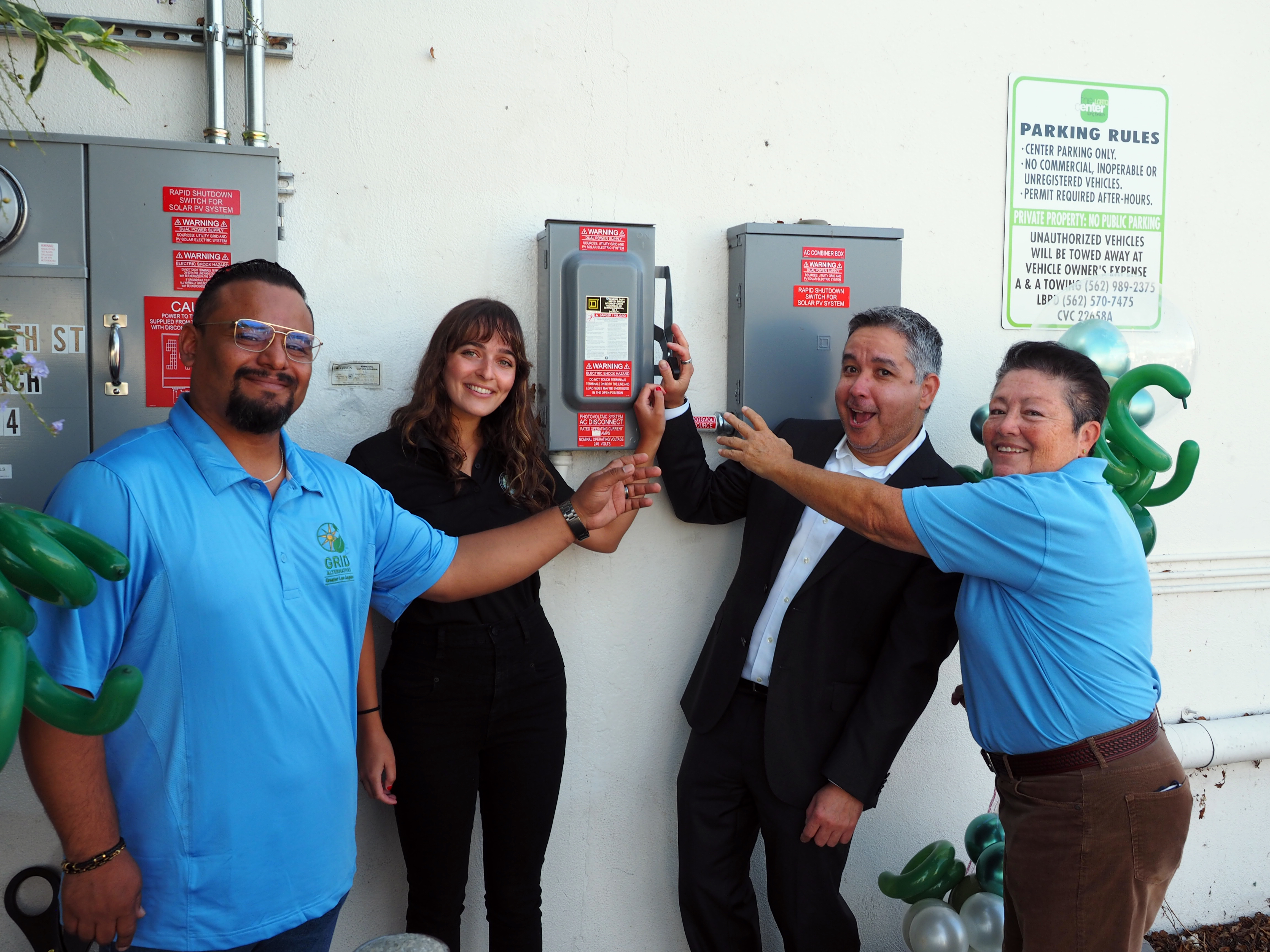 GRID GLA and LGBTQ Center Long Beach staff powering on the LGBTQ Center's solar system together