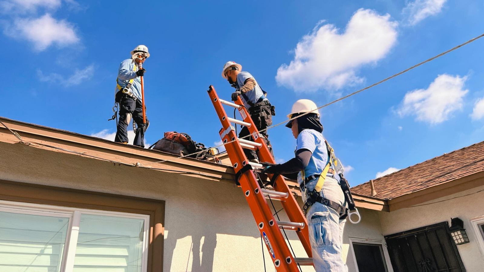 GRID GLA construction staff installing rooftop solar 