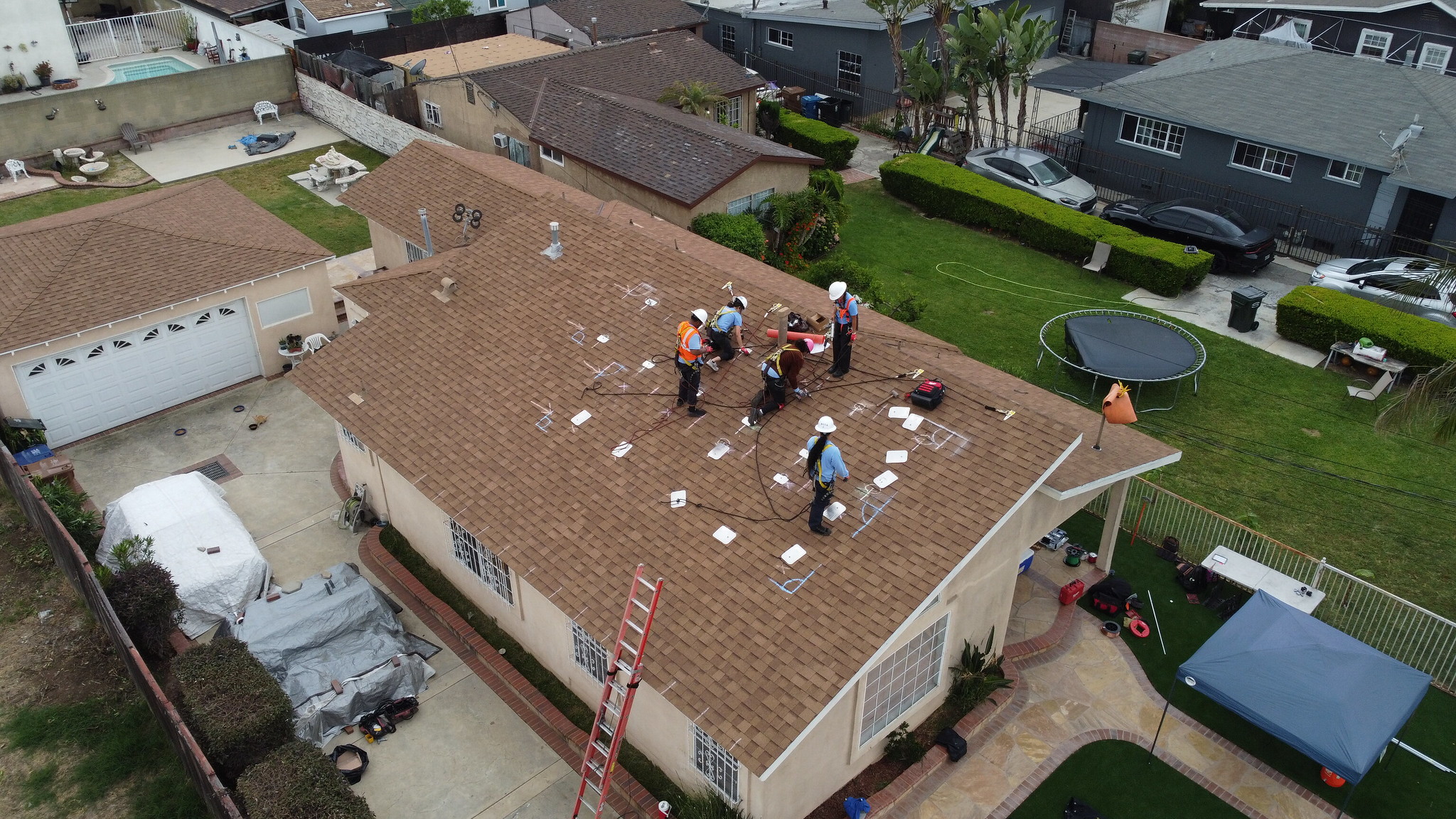 GRID GLA construction staff installing residential solar panels  