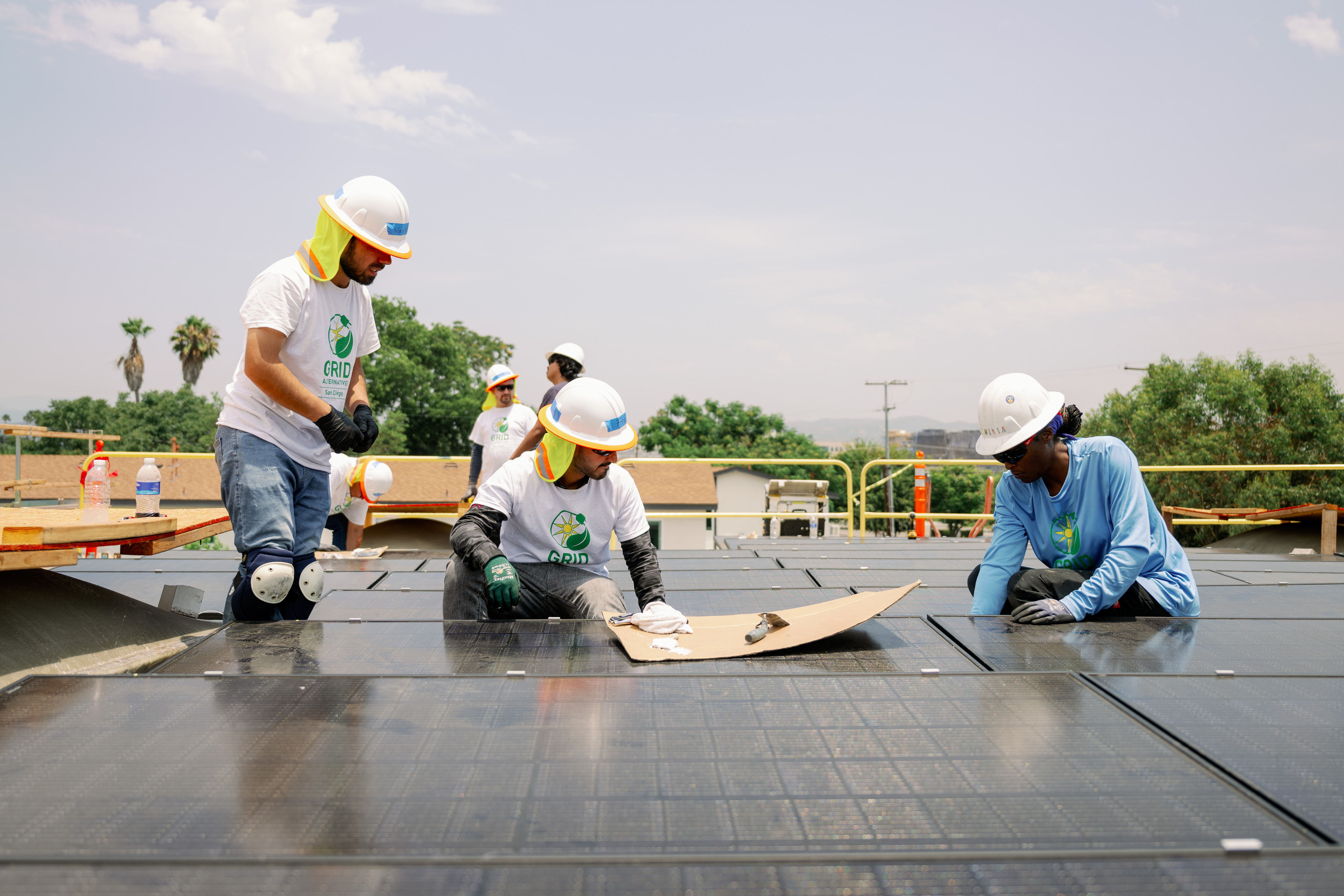 grid staff working on sdcdm roof 