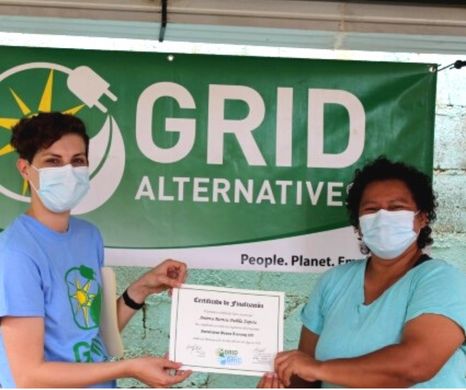 America Padilla receiving her solar installation certificate