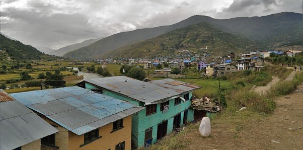 The village nestled within the mountains.