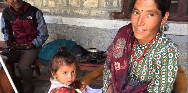Nepali mother and child at a health Post