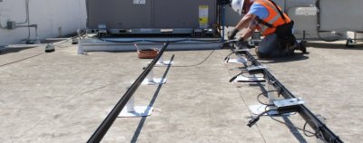 solar installer working on grid