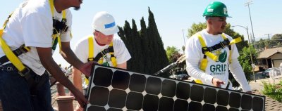 People working with solar panel