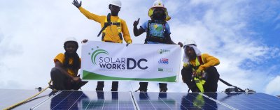 Solar Works DC trainees up on the roof during an install.