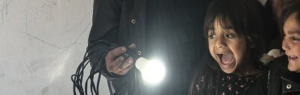 Two girls happy looking at light bulb