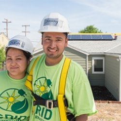 couple smiling in grid shirts