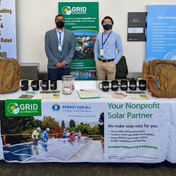 GRID staff standing at our booth for the 2022 Housing California conference.