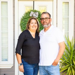 Hilda and Rafael Barragan welcoming people at their front door.