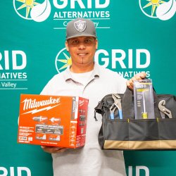 Man holding tool bag for a photo