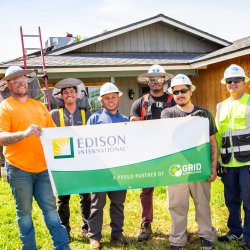 men holding a partner signage from SCE