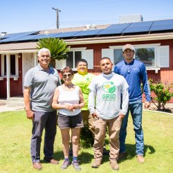 Construction Staff posing for photo with homeowner