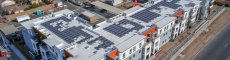 Drone shot of multifamily complex covered in solar