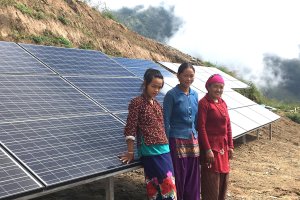 Three Nepali women by solar system