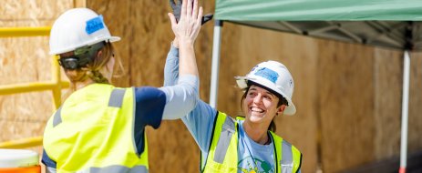 grid staff giving high fives