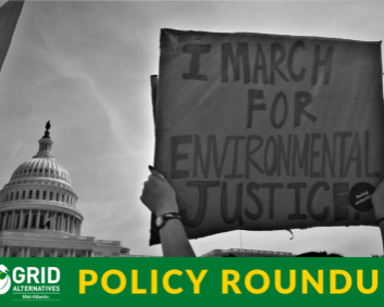An advocate at the U.S. Capitol holds up a sign that says "I march for environmental justice."