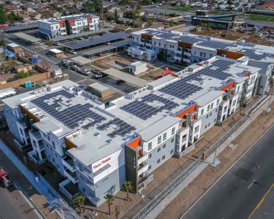 Drone shot of multifamily complex covered in solar