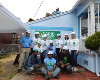 GRID Alternatives Bay Area construction team posing next to BMO[Bank of Montreal] volunteers
