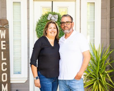 Hilda and Rafael Barragan welcoming people at their front door.