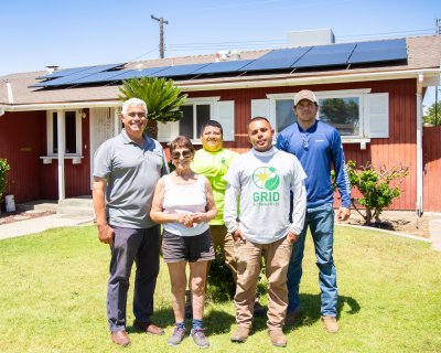 Construction Staff posing for photo with homeowner