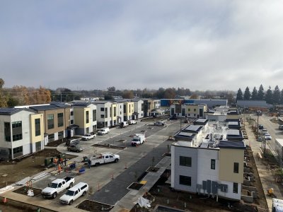 Mirasol Village still under construction, with solar panels visible.