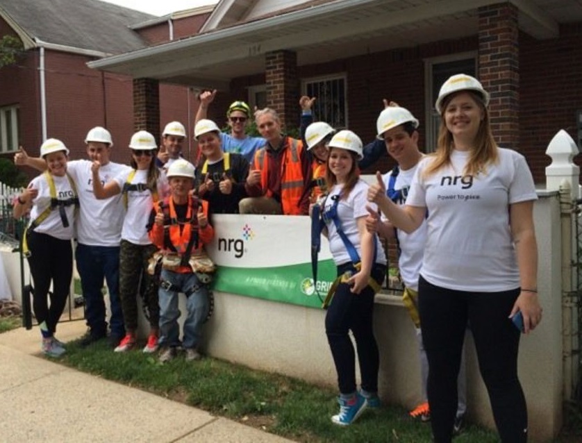 Group of volunteers in hard hats and NRG shirts at home energy project on Staten Island