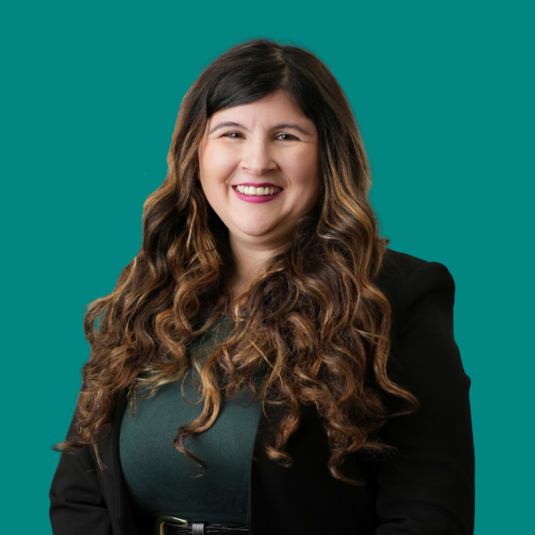 Karina Gonzales, professional headshot against teal background