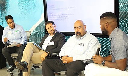 Four men participate in a panel discussion about solar jobs and second chances reentry hiring