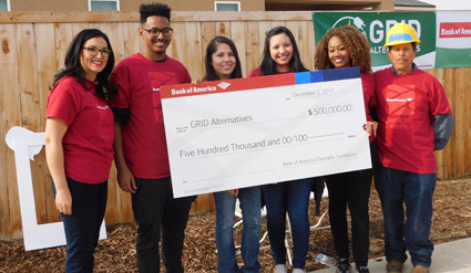 Six people in red shirts holding a $500,000 check from Bank of America for GRO Alternatives
