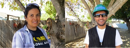Two UC Davis Humphrey Fellows outdoors wearing hats and smiling at camera