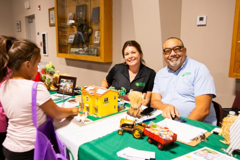 two staff members tabling at an event