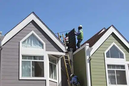 Trainees and GRID staff installing for Aguayo Family