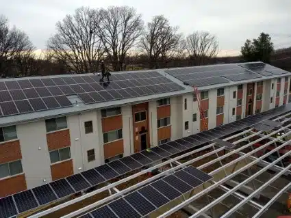 Modern apartment building with solar panels covering the roof