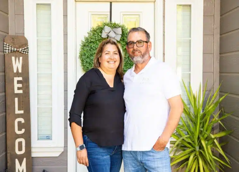 Hilda and Rafael Barragan welcoming people at their front door.