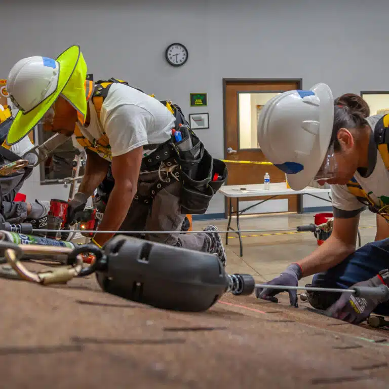 Students from our historic first cohort working on our mock roof at the CTTC in Riverside, CA