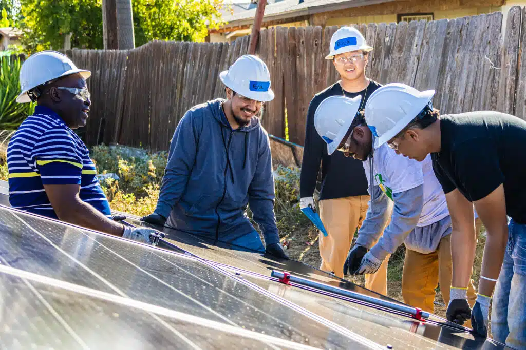 Group of people working on panel