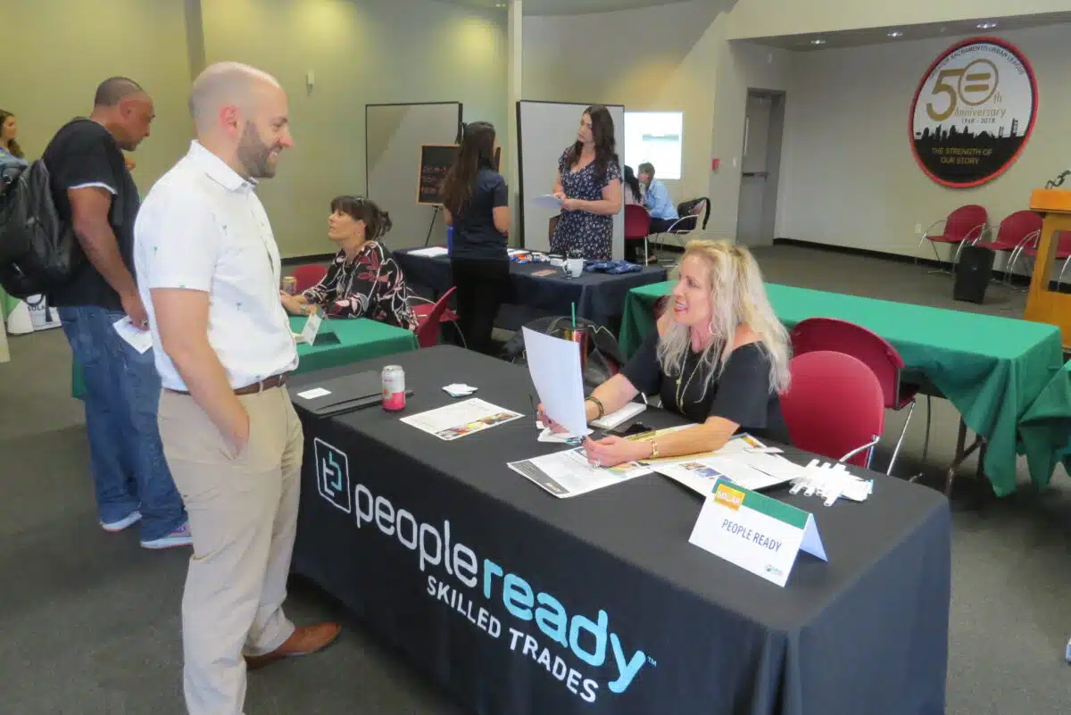 People Ready Skilled Trades booth at career event with staff talking to visitors