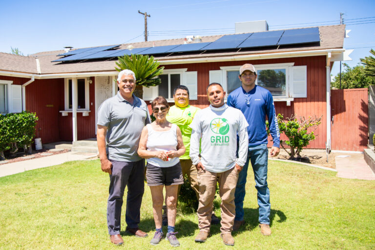 Construction Staff posing for photo with homeowner