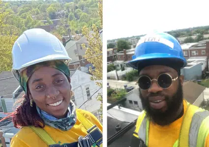 Two construction workers wearing hard hats and safety gear smiling at camera on job sites