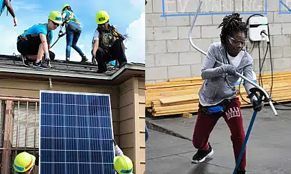 Workers installing solar panels on residential rooftops with safety equipment