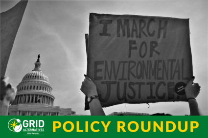 An advocate at the U.S. Capitol holds up a sign that says "I march for environmental justice."