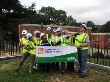 SEPA Corporate Workday volunteers pose with a banner